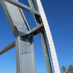 Detail view of the galvanized straight beams and angle connectors that make the bow.