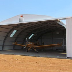 View of the Embraer Ipanema parked inside the hangar, there's easy access because the wingspan is 11,6m and the door has a 15m opening.