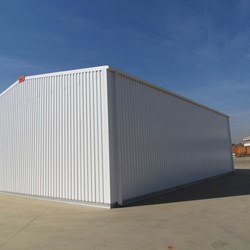 rear view of a hangar Delta, structure is made from galvanized steel, cladding is galvanized and pre painted in white to reflect heat