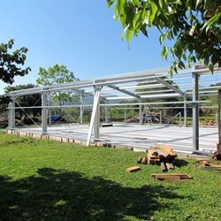 the four spans in place, connected with purlins and secured by wind braces