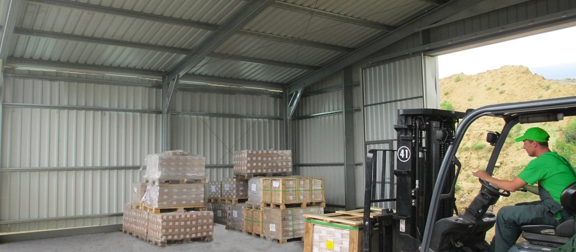a forklift stacking pallets in a Frisomat Delta warehouse