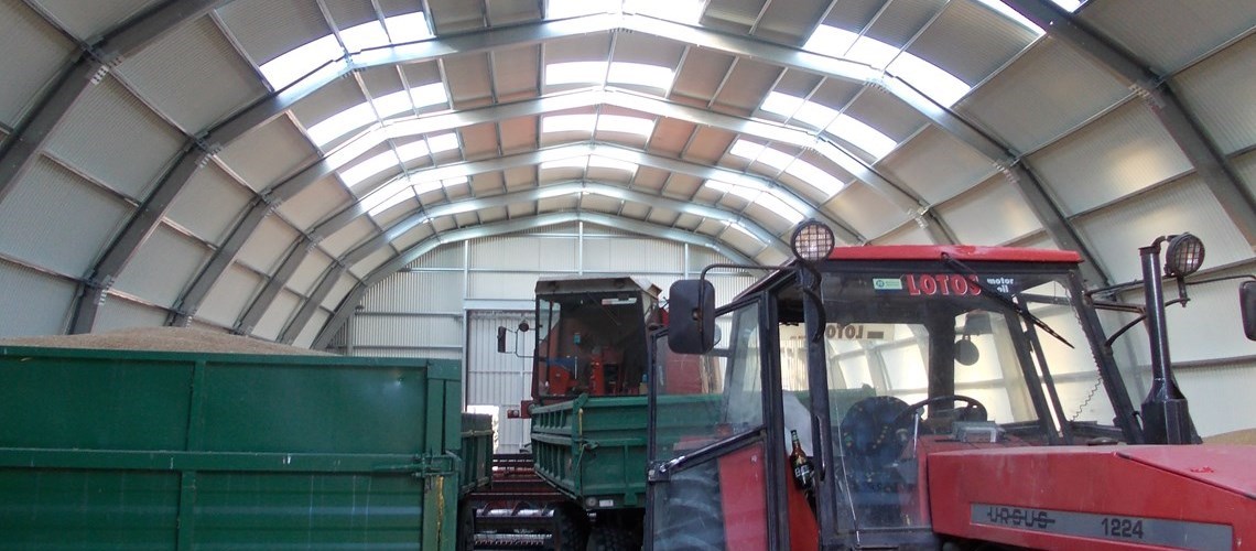 Interior view of a barn used to garage farm equipment like tractors, a combined harvester etc…
